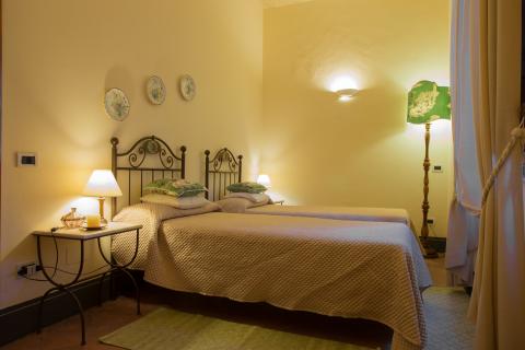 Slaapkamer in luxe vakantiehuis in Pisa
